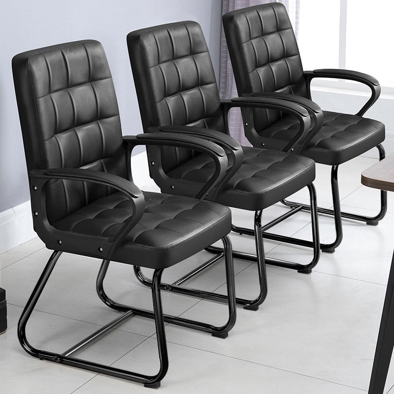 Three black office chairs arranged in a row on a light-colored floor.